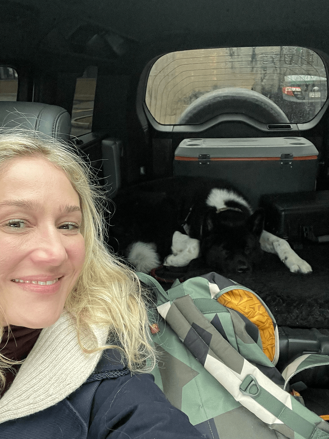 She loves her dog and enjoying the car drinving around